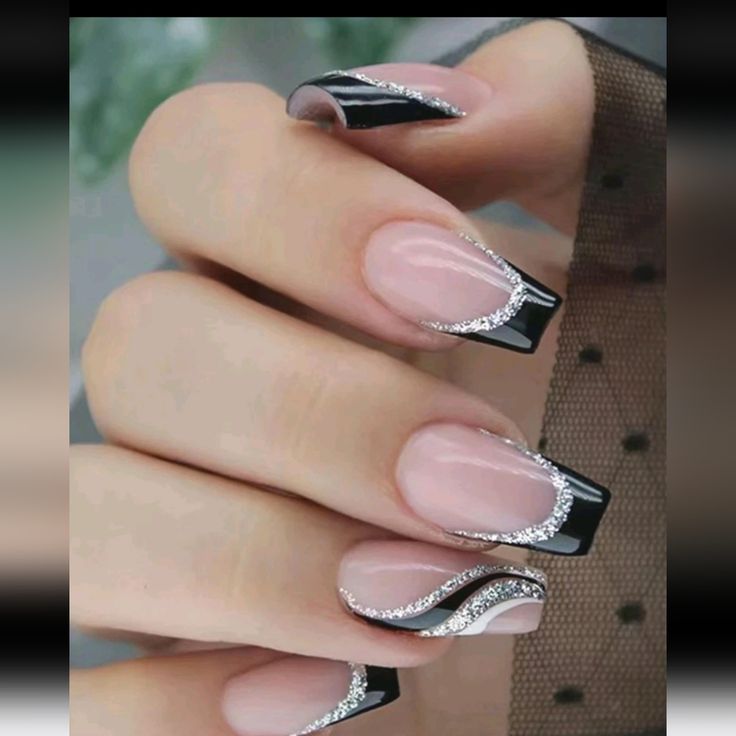 Sophisticated Nail Design: Nude and Deep Black with Intricate Silver Wave Patterns.