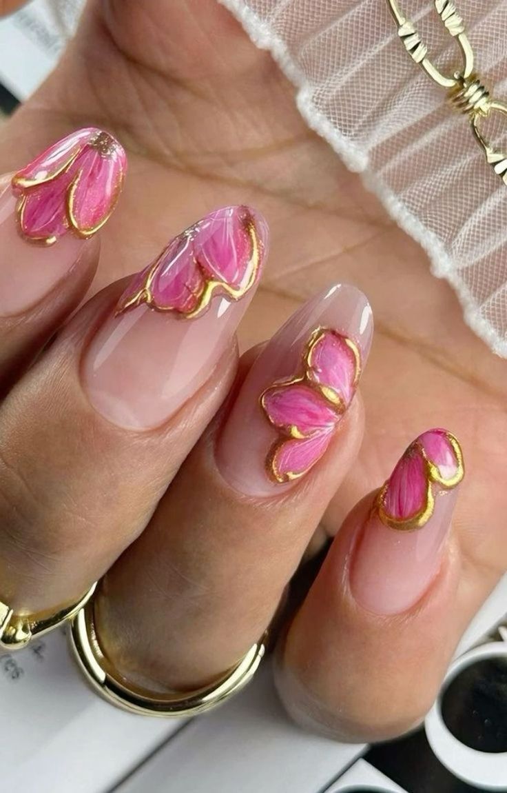 Vibrant Floral Nail Design Enhanced with Delicate Gold Accents for an Elegant Spring Look.