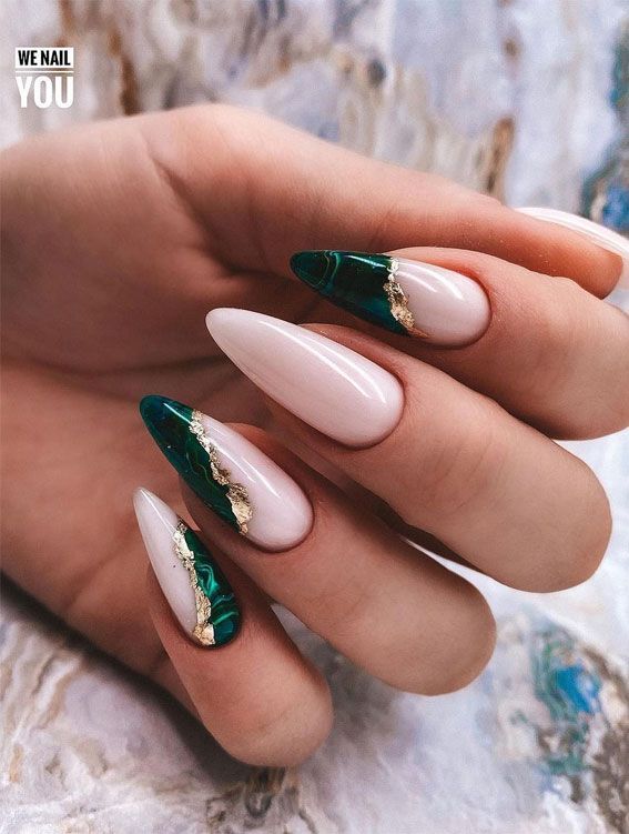 Sophisticated Nude and Deep Green Marble Nail Design with Gold Accents.