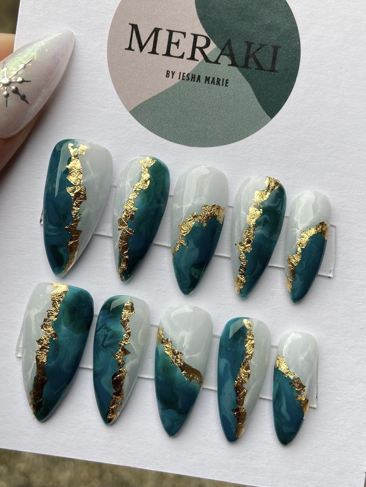 Elegant Deep Teal and White Nail Design with Luxurious Gold Accents.