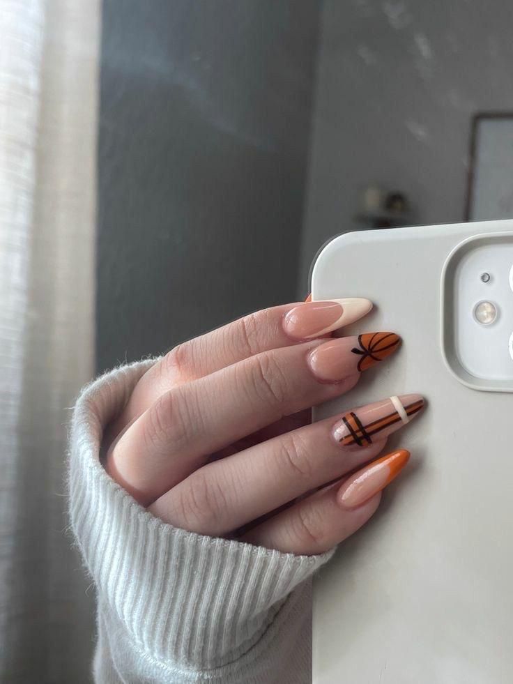 Playful Almond-Shaped Nail Design with Warm Tones and Geometric Patterns.