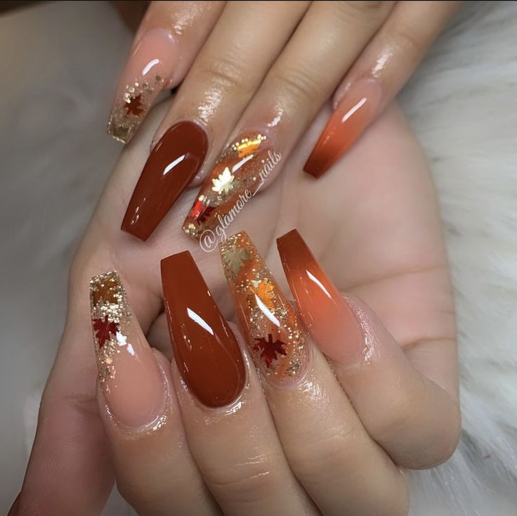 Elegant Autumn Nail Design: Metallic Gold Accents with Leaf Patterns in Orange and Nude Shades