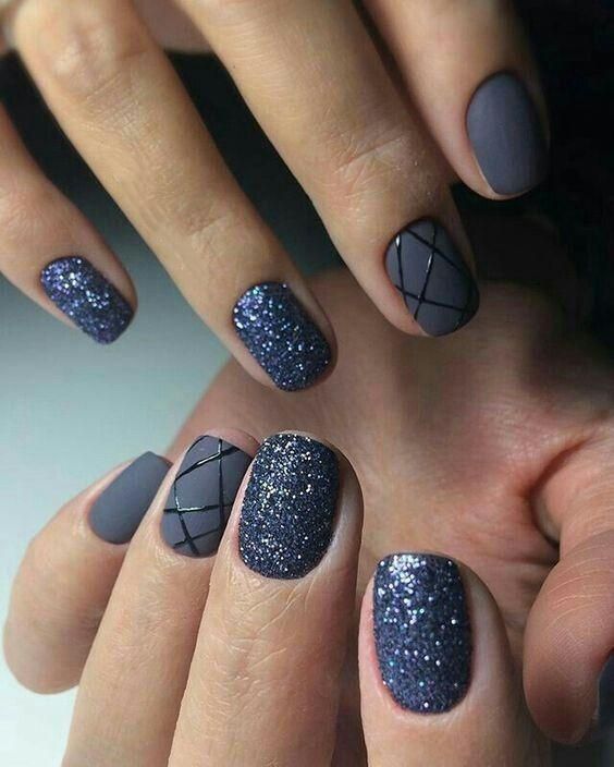 Chic Nail Design: Matte and Glitter Fusion with Geometric Patterns in Dark Hues.