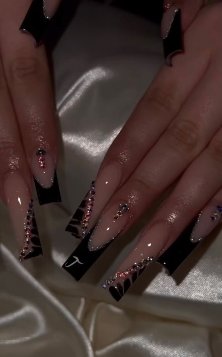 Dramatic Long Black-Tipped Nail Design with Glamorous Rhinestone Detailing.