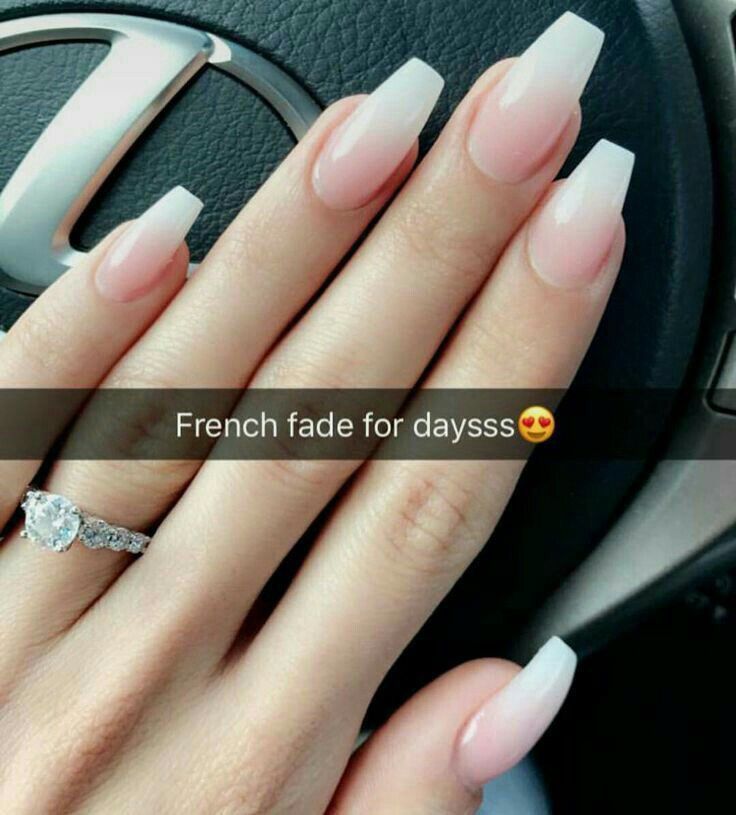 Chic Elegant French Fade Nails: Soft Pink to Crisp White Gradient with Sophisticated Elongated Shape and Delicate Silver Ring.