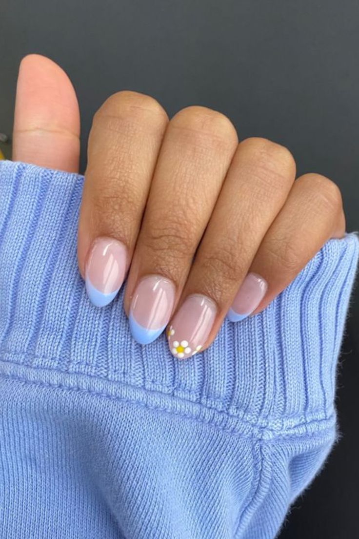 Pastel Gradient Nail Design with Floral Accent for a Stylish, Trendy Look.