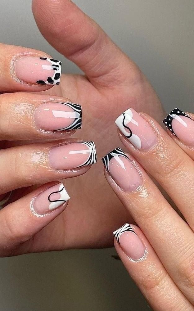 Chic Nude and Black White Nail Design with Artistic Geometric Patterns.