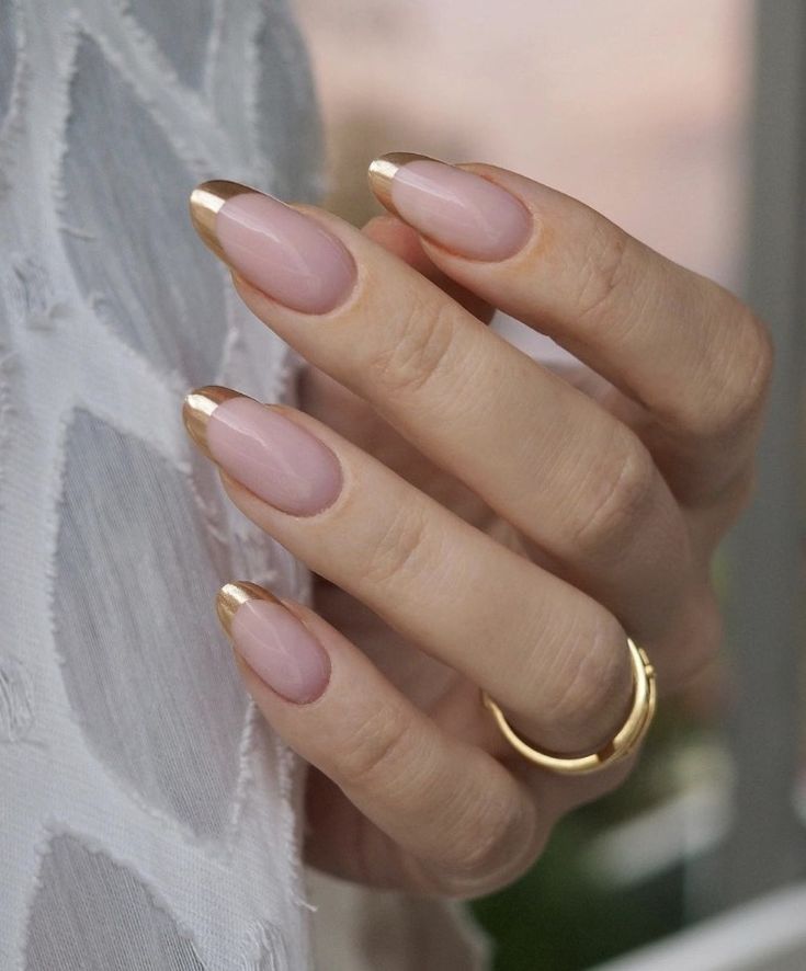 Chic Elegance: Nude Nails with Sophisticated Gold French Tips for Versatile Styling.