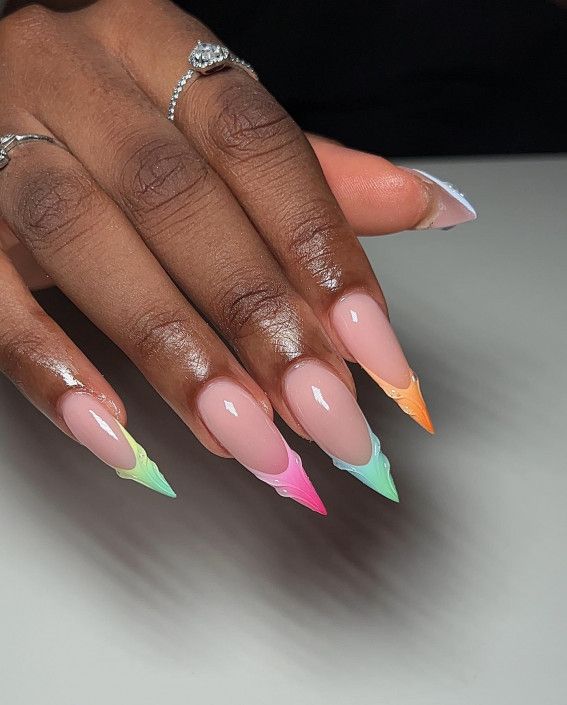 Elegant Gradient Claw Nails: Soft Nude Base with Vibrant Pastel Tips.