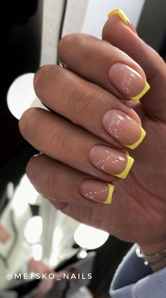 Vibrant Yellow French Tips: A Fresh Twist on Classic Manicure for Spring/Summer.