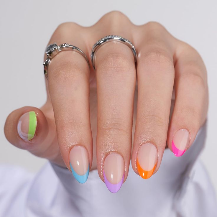 Vibrant Neon French Tips on Nude Base: A Trendy Nail Design.