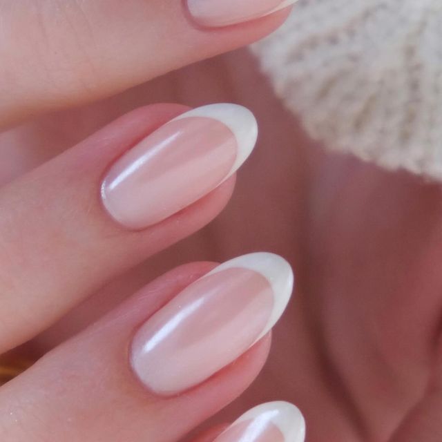 Sophisticated Soft Pink French Tip Nail Design for Any Occasion