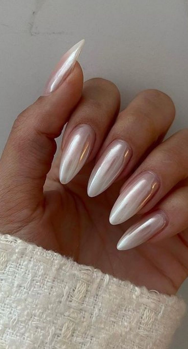 Sophisticated Almond-Shaped Nails with Pearlescent Finish for Elegant Versatility.