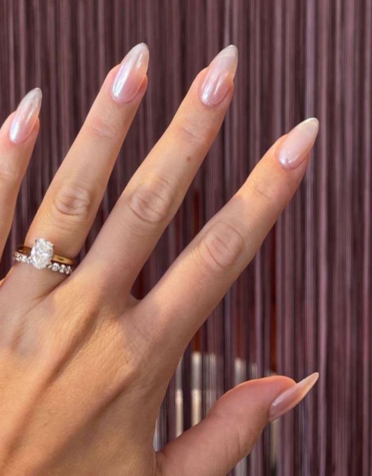 Chic Almond-Shaped Nails with Soft Translucent Pink Hue for Everyday Elegance.