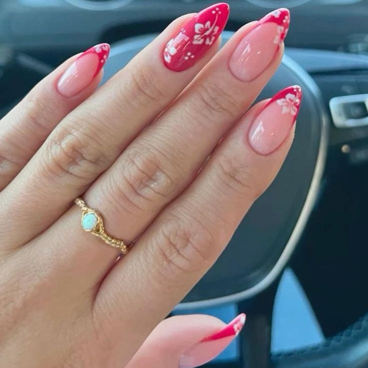 Elegant Almond-Shaped Nail Design: Bold Red and Nude with Floral Accents.