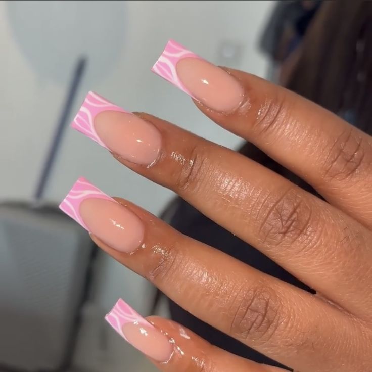 Modern Nude and Pink Geometric Nail Design with Negative Space Accents.