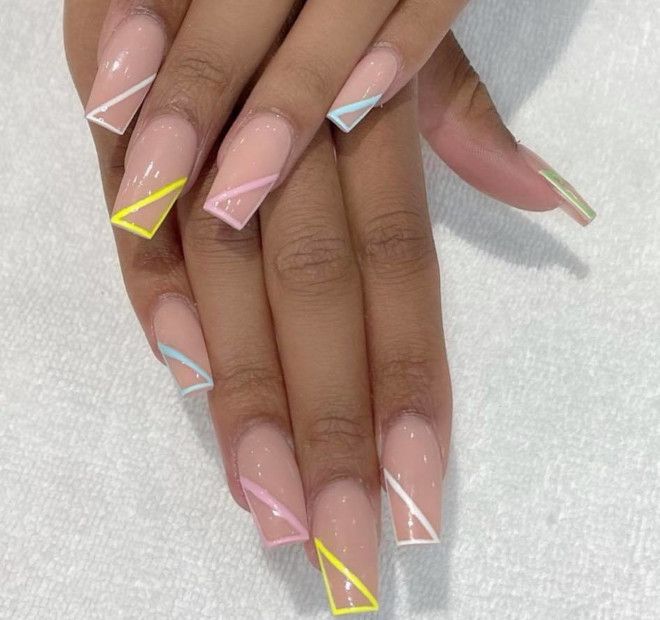 Chic Geometric Nail Design with Colorful Triangular Accents on a Nude Base.