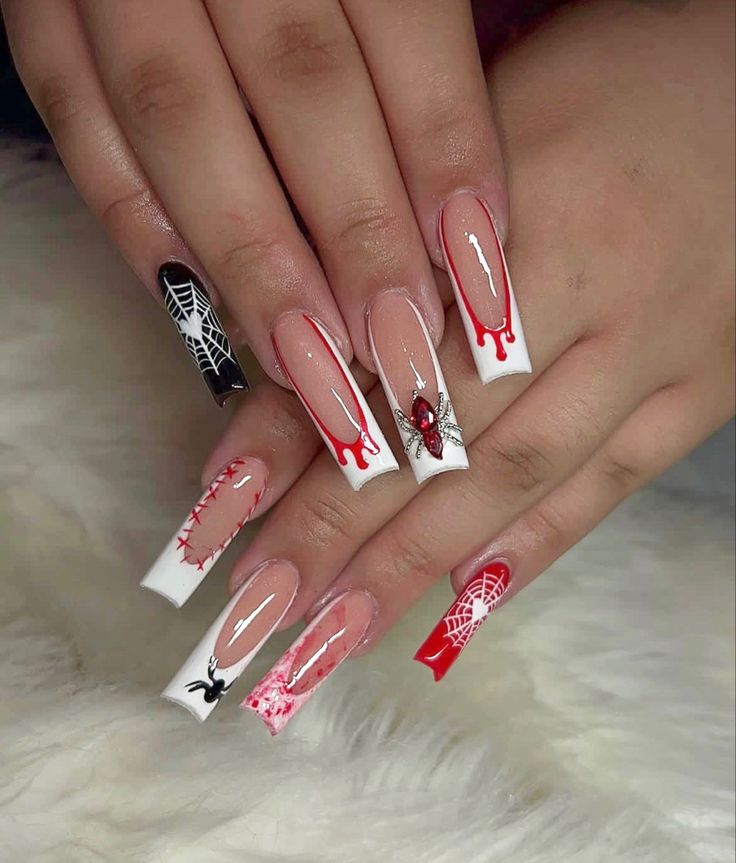 Dramatic Nail Art:Intricate Spider Webs and Red Drips for a Bold Statement