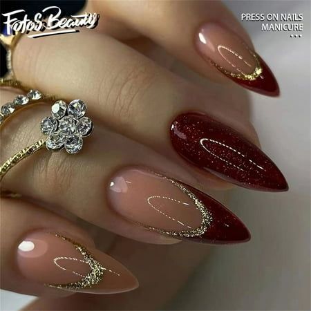 Sophisticated Ombre Nail Design in Beige and Deep Red with Gold Accents.