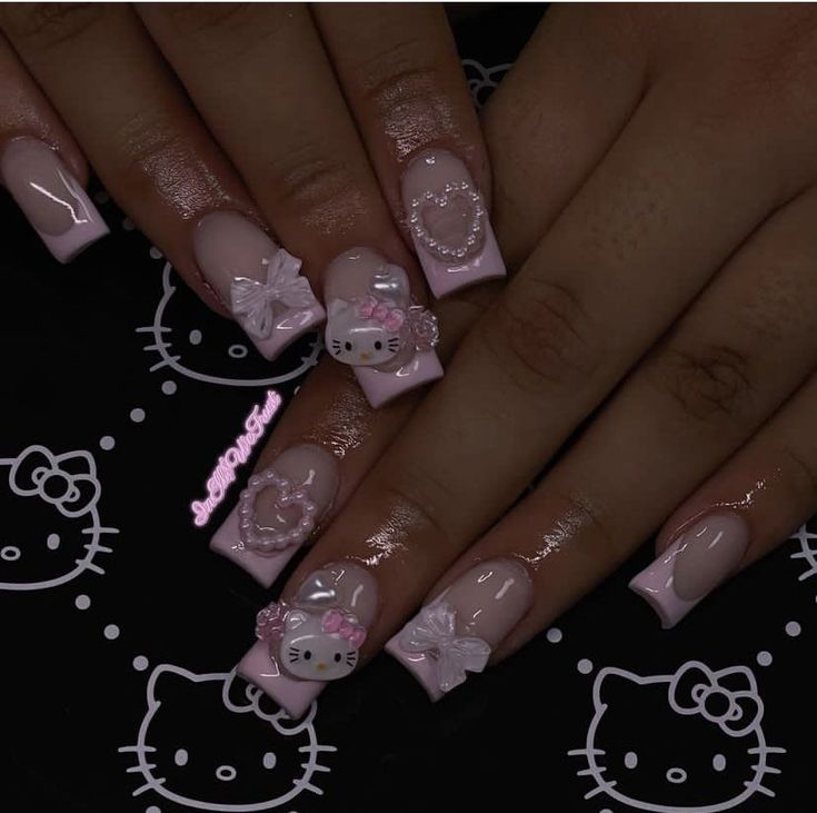 Charming Whimsical Nail Design with Soft Pink Hues and Playful Floral Accents.