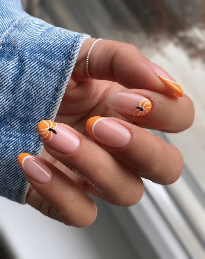 Citrus-Inspired Summer Nail Design with Playful Orange Slices and Whimsical Accents.