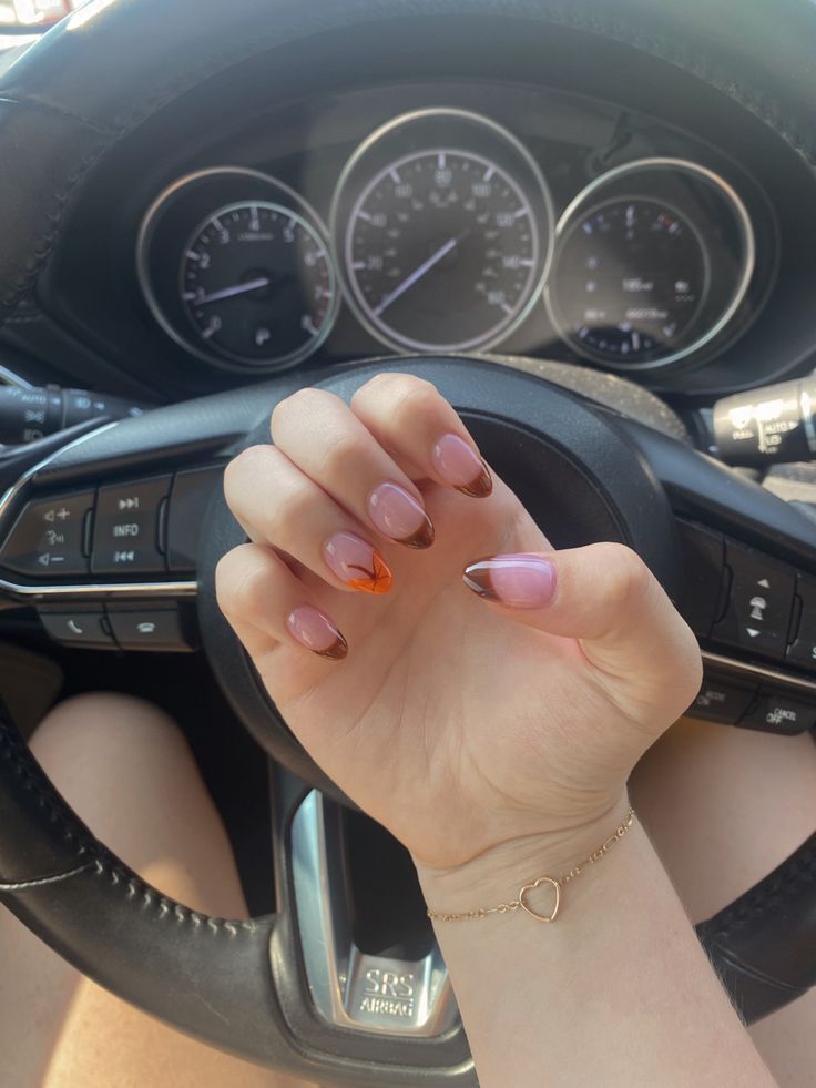 Chic Gradient Nail Design with Glossy Orange Accents