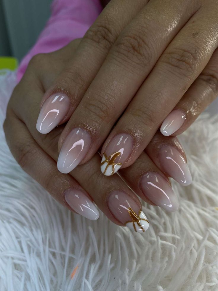 Elegant Gradient Nail Art: Soft Colors with Gold Accents and Marble Patterns