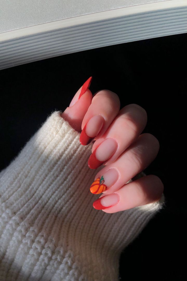 Chic Fruit-Inspired Nail Design with Peachy-Orange Tips for a Stylish, Relaxed Look.