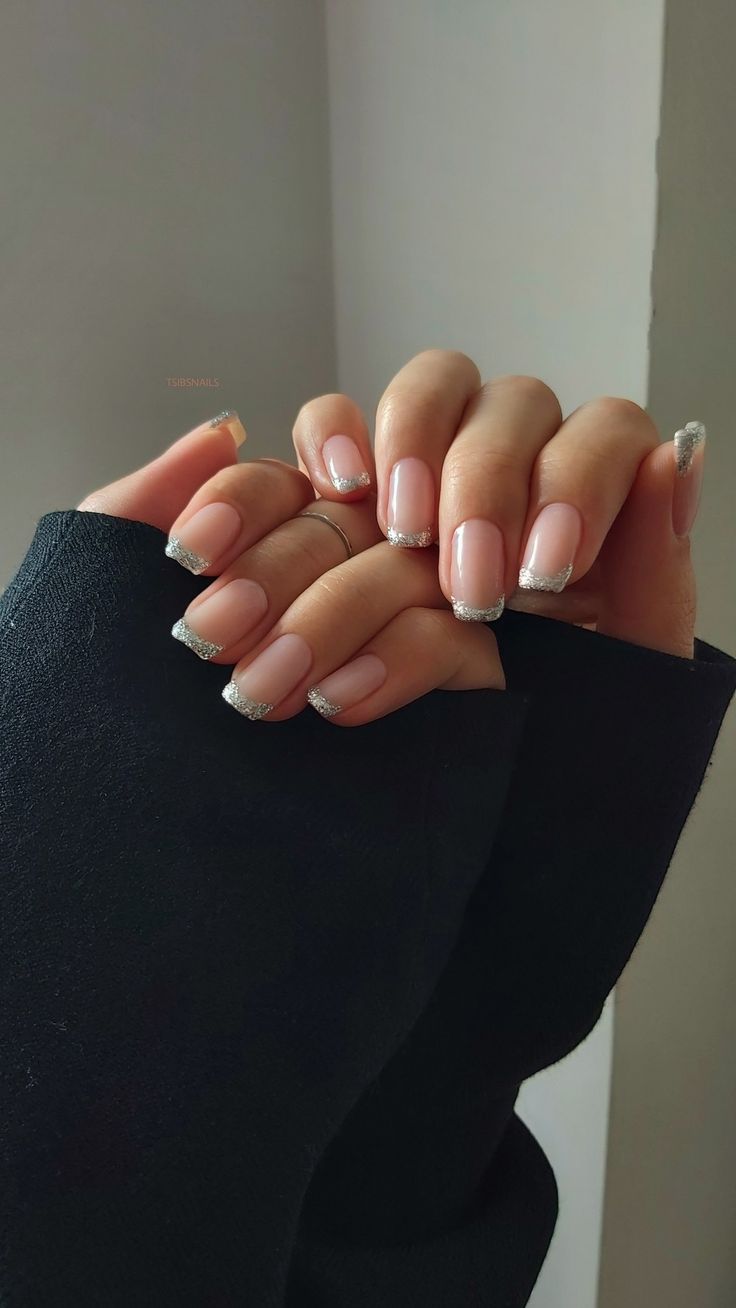 Sophisticated Nail Design: Soft Nude Base with Elegant Silver Tips