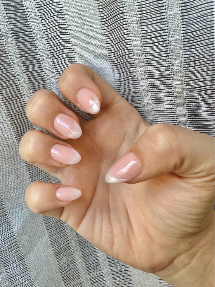 Chic Almond-Shaped Nail Design: Soft Pink Base with Delicate White Tips for Effortless Sophistication.