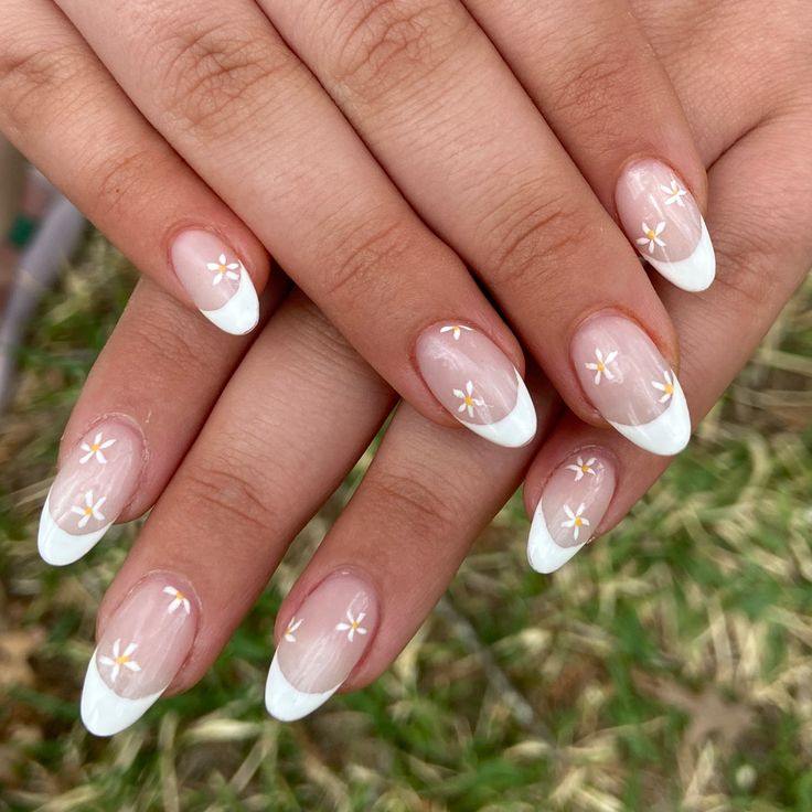 Elegant Floral Nail Design with White Tips and Golden Accents.