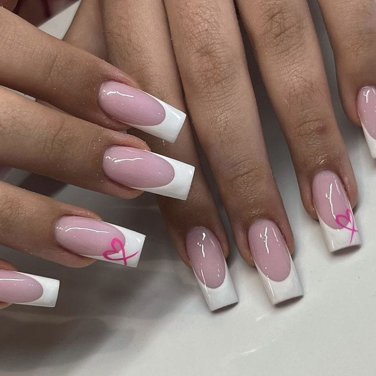 Chic Soft Pink and White Nail Design with Heart Accents for Any Occasion.