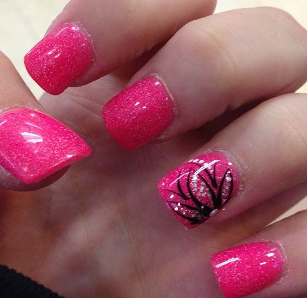 Playful Glamour: Vibrant Pink Nails with Sparkly Accents and Artistic Black Design