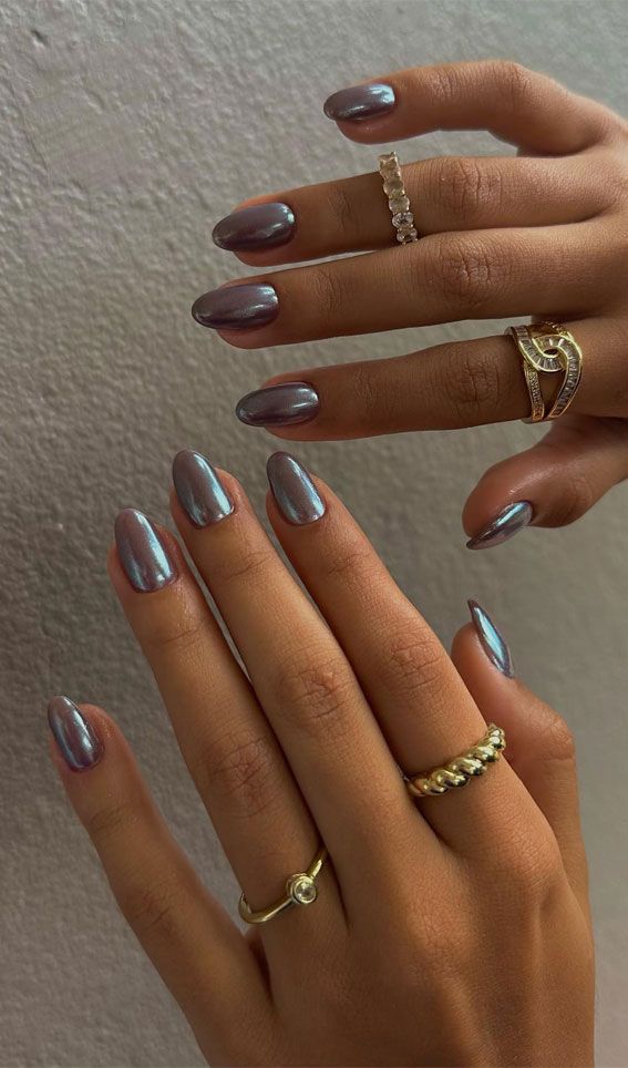 Chic Iridescent Almond-Shaped Nail Design Enhanced with Elegant Rings