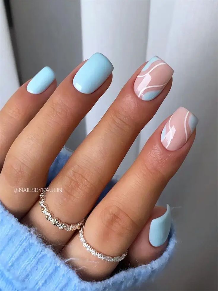 Elegant Pastel Nail Design with Abstract Swirls for a Trendy Touch.