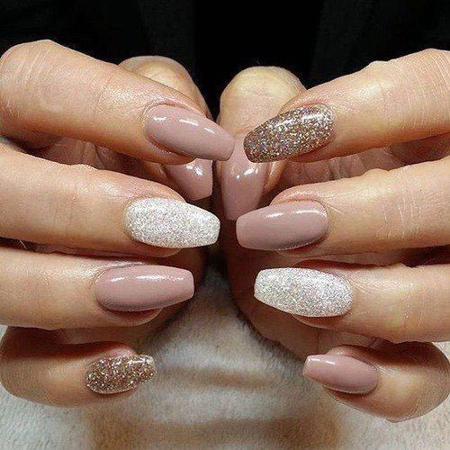 Elegant Soft Nude Nail Design with Shimmering Accents for Any Occasion.