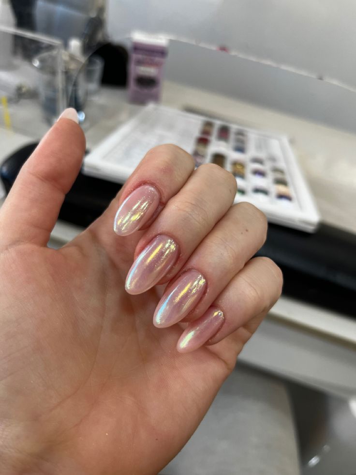 Sophisticated Ombre Nails with Soft Pink and Iridescent Shimmer