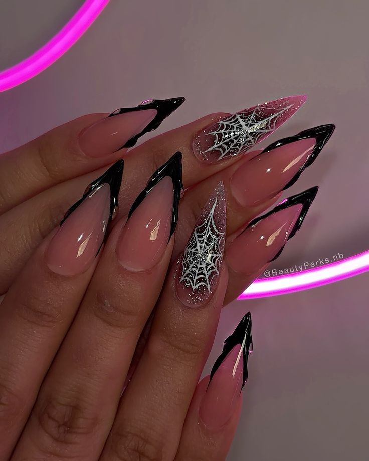 Chic Stiletto Nail Design with Soft Pink and Bold Black Accents