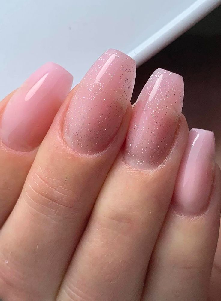 Elegant Soft Pink Nail Design with Glossy, Matte Finishes and Subtle Glitter.