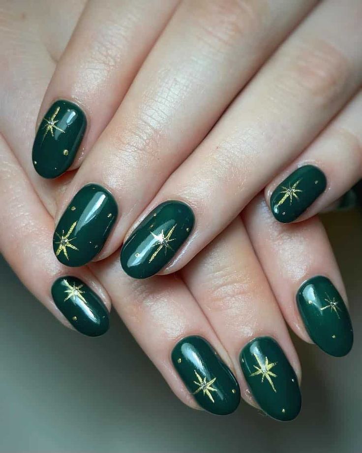 Elegant Green Nail Design with Glossy Finish, Metallic Gold Accents, and Whimsical Star Motifs.