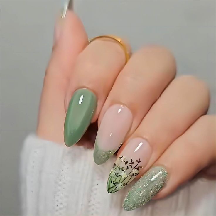 Elegant Floral Nail Design with Soft Greens and Glitter Accents