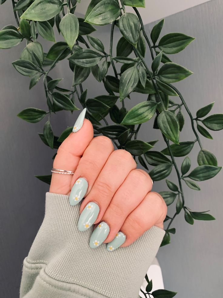 Sophisticated Mint Green Nails with Glossy Finish and Floral Accents for Trendy Occasions