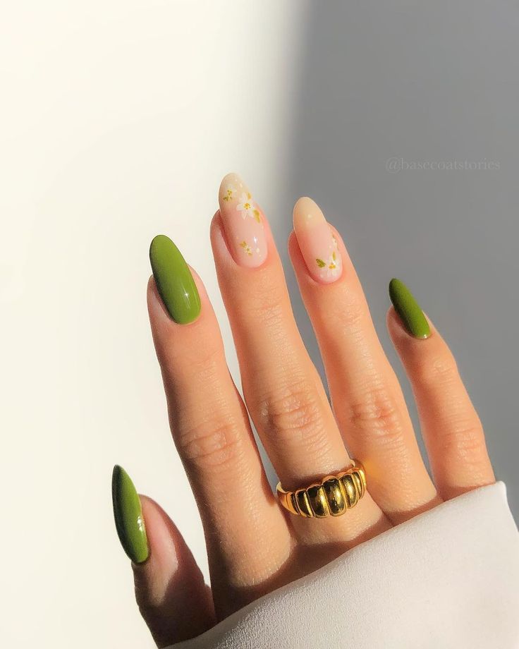 Elegant Nail Design with Soft Neutrals and Bold Green Accents