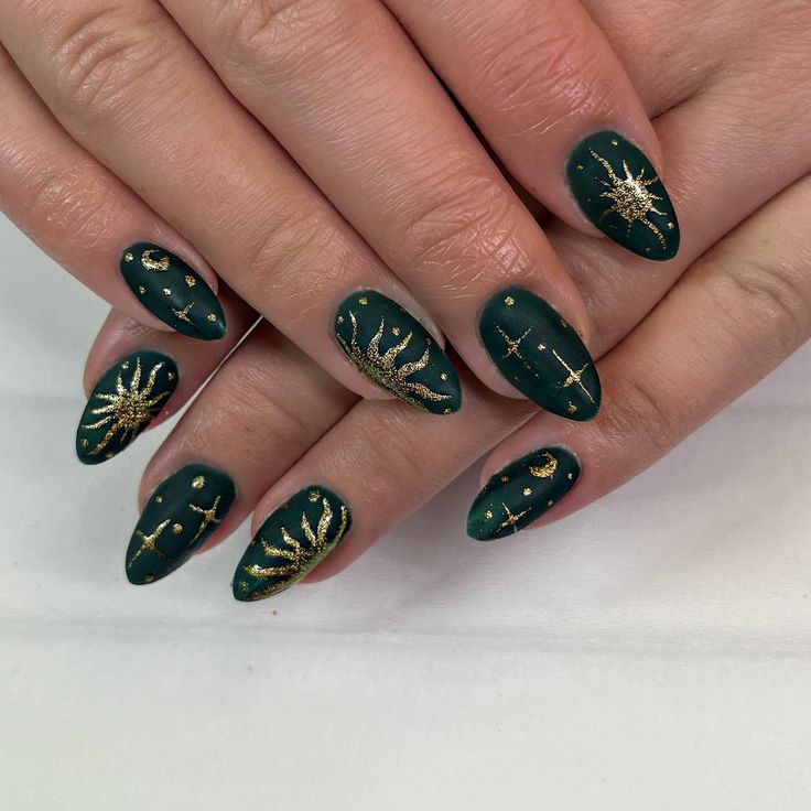 Elegant Emerald Green Matte Nails with Celestial Gold Embellishments.