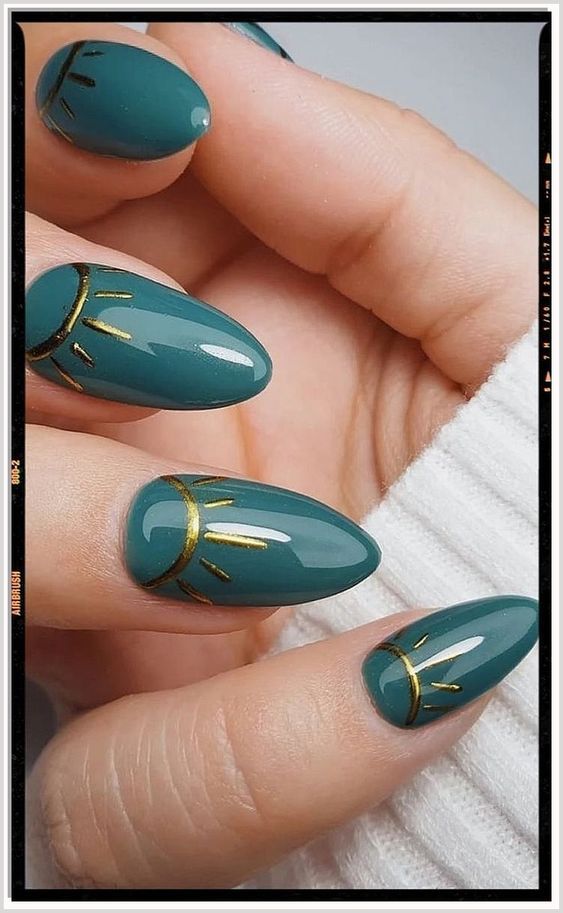 Chic Teal Almond Nails with Bold Gold Geometric Accents