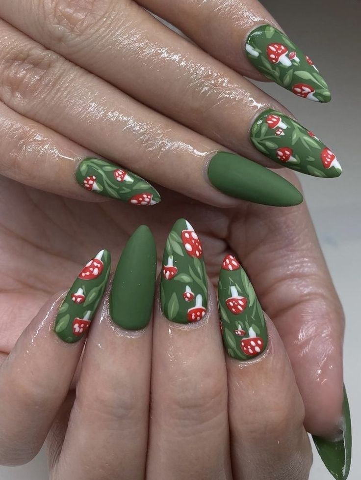 Playful Floral Nail Design with Matte Green Base and Vibrant Red Mushrooms.