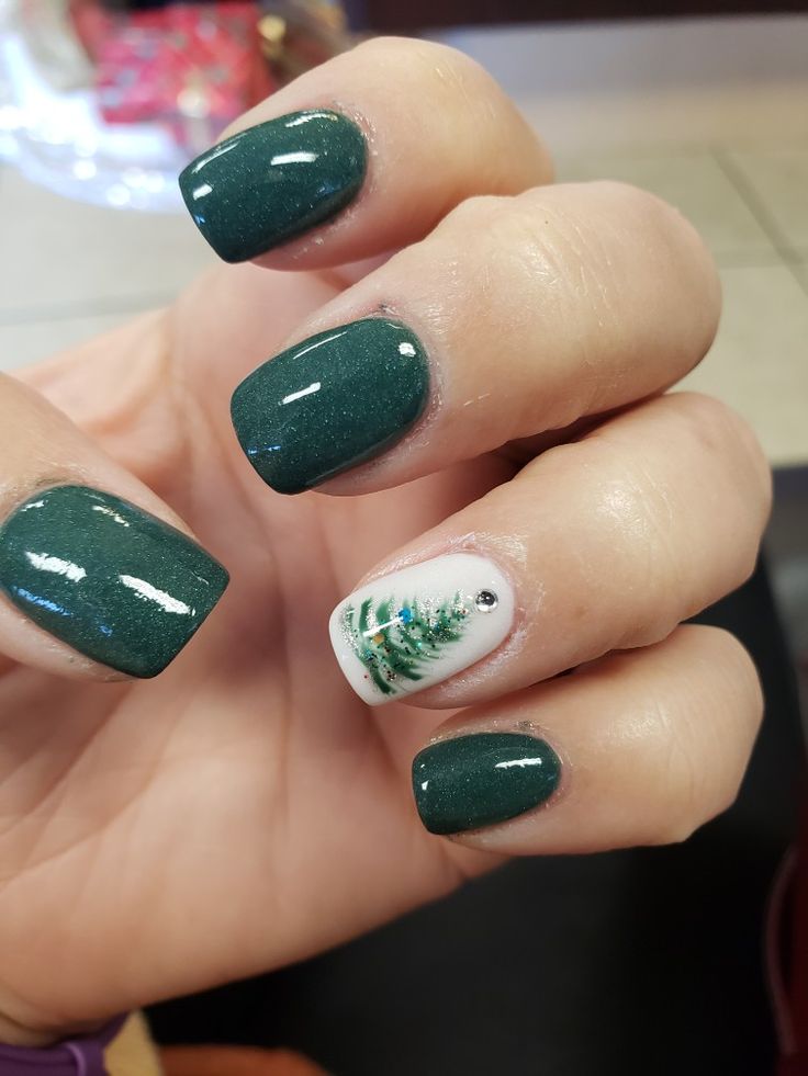 Elegant Holiday Green Nail Design with Sparkling Base and Evergreen Tree Accent