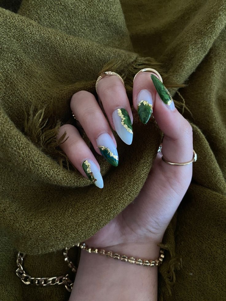 Sophisticated Nail Design: White and Green Hues with Gold Accents for a Glamorous Statement.