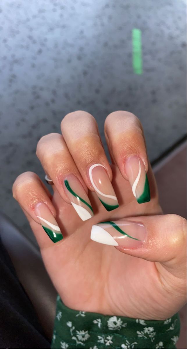 Chic Geometric Green and White Nail Design with Creative Elegance.