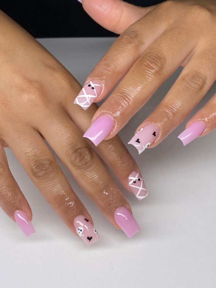 Elegant Pink and White Nail Design with Playful Hearts and Geometric Patterns.